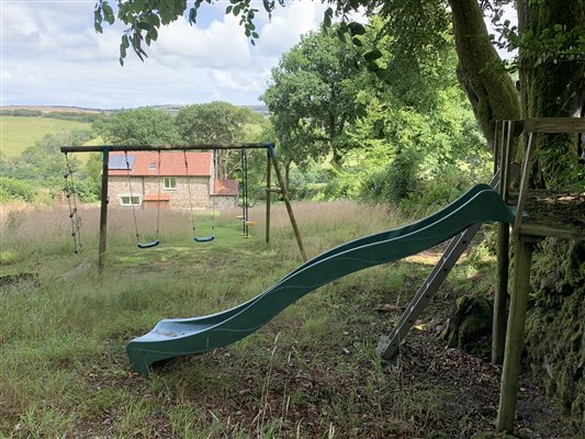 View of the Red Linhay from Play area in garden